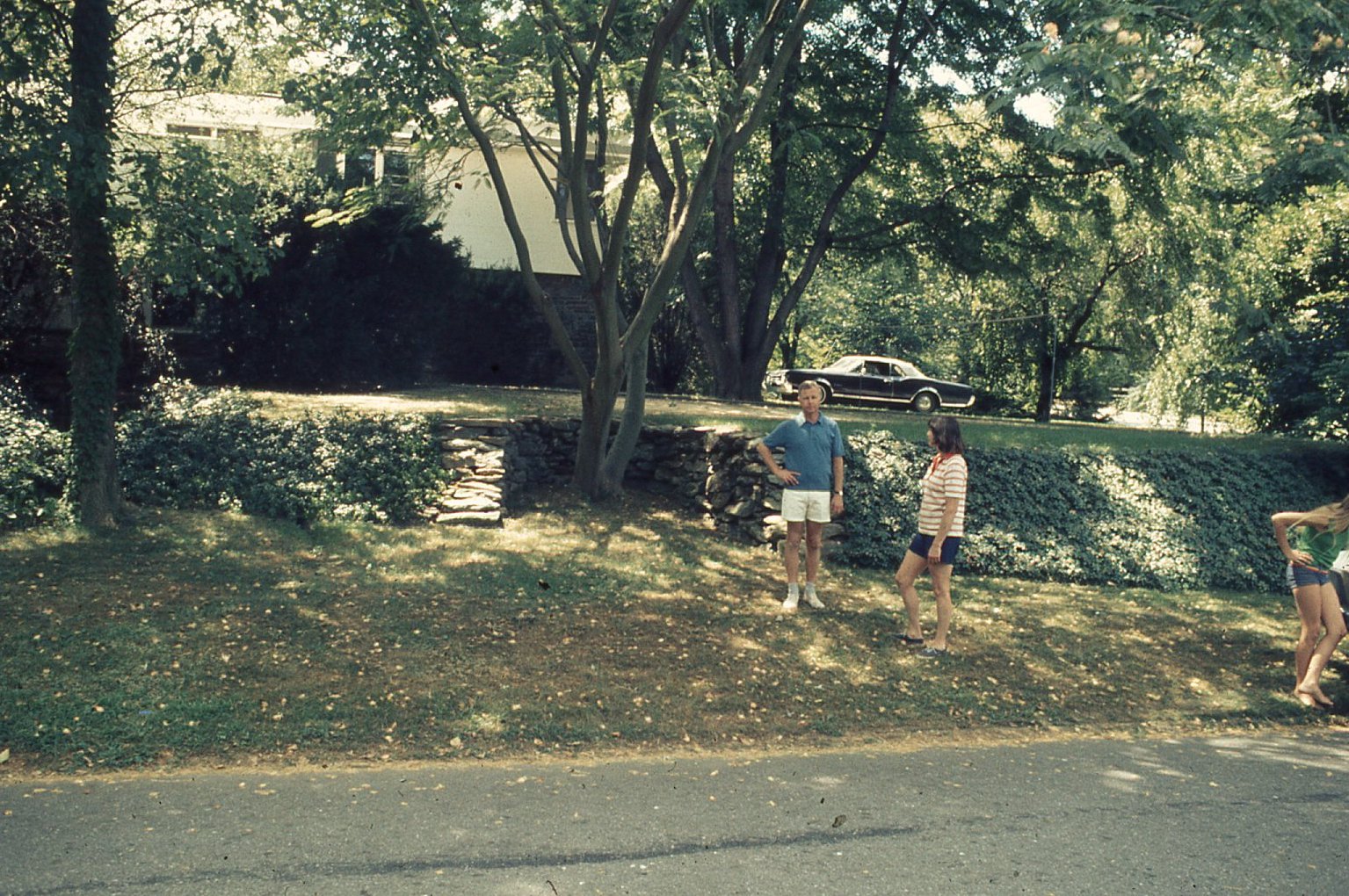 photo: John and Flo with Olds Cutlass Supreme in background