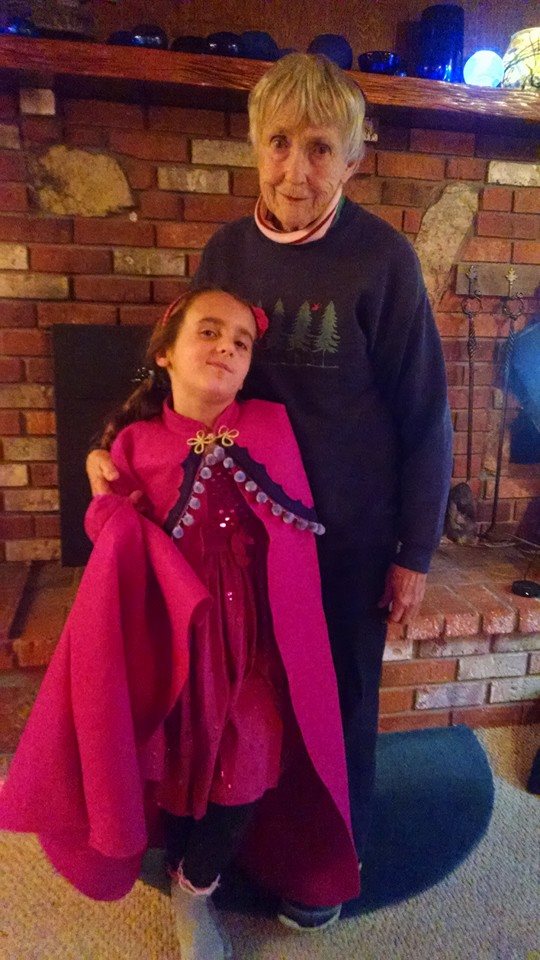 photo: Zoe and Flo with Anna cape made by Flo
